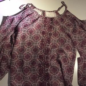 A shirt that shows your shoulders but long sleeve.